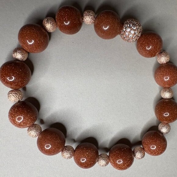 bracelet features large, polished goldstone beads - Picture 2 of 3